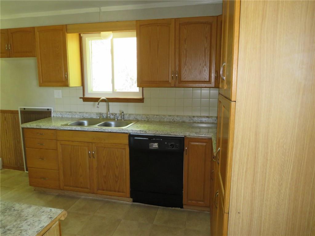 21 Daisytown Road Brownsville, PA 15417 - Photo 8 of 31 a bathroom with a granite countertop sink and a mirror