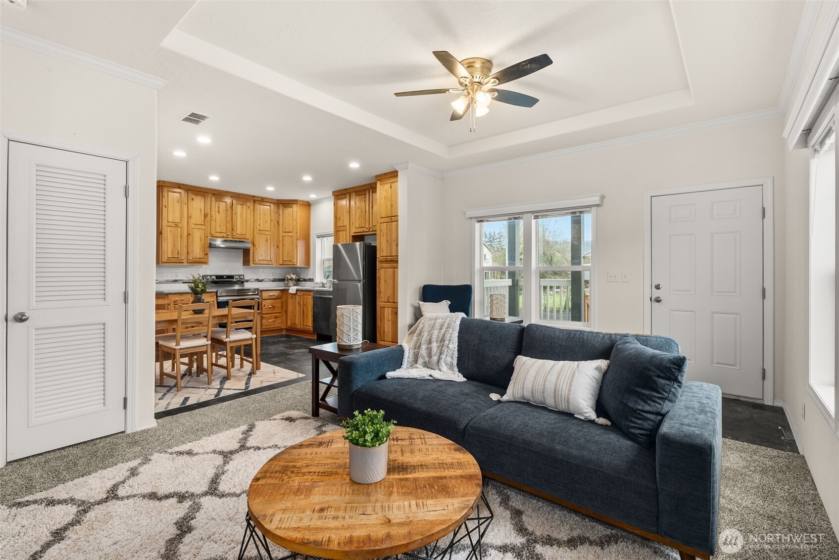 1257 Southwest Elzina Street Chehalis, WA 98532 - Photo 13 of 28 a living room with furniture kitchen view and a wooden floor