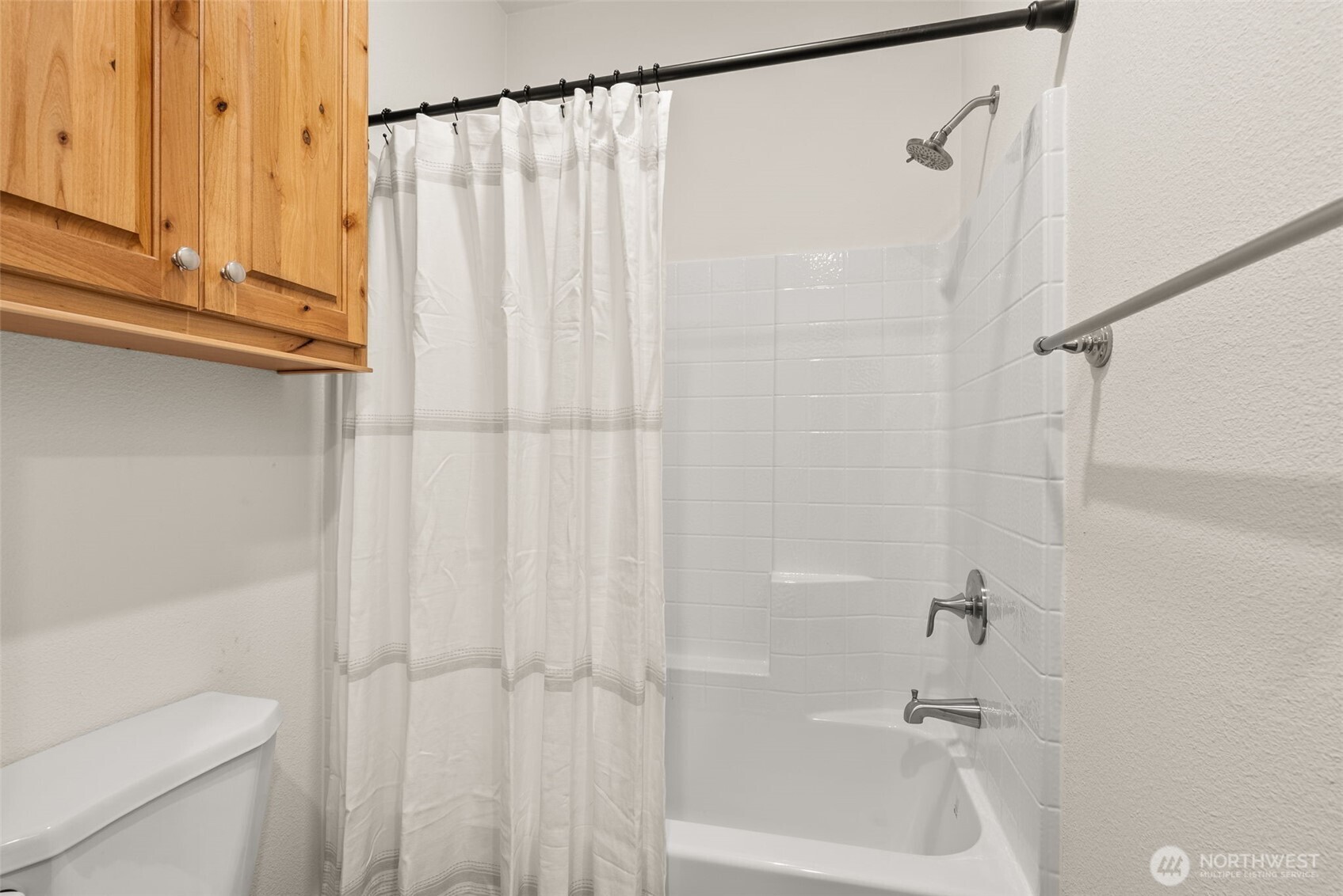 1257 Southwest Elzina Street Chehalis, WA 98532 - Photo 19 of 28 a bathroom with a shower and a toilet