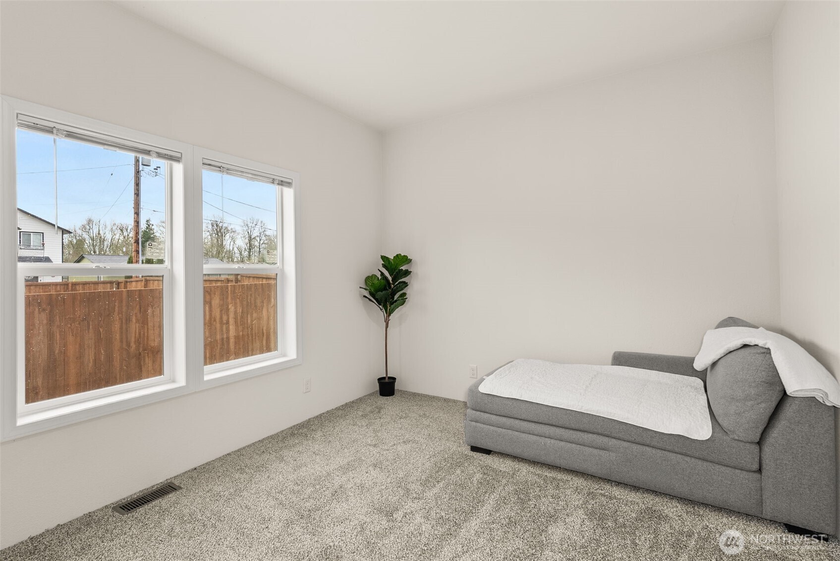 1257 Southwest Elzina Street Chehalis, WA 98532 - Photo 20 of 28 a spacious bedroom with a bed and a window