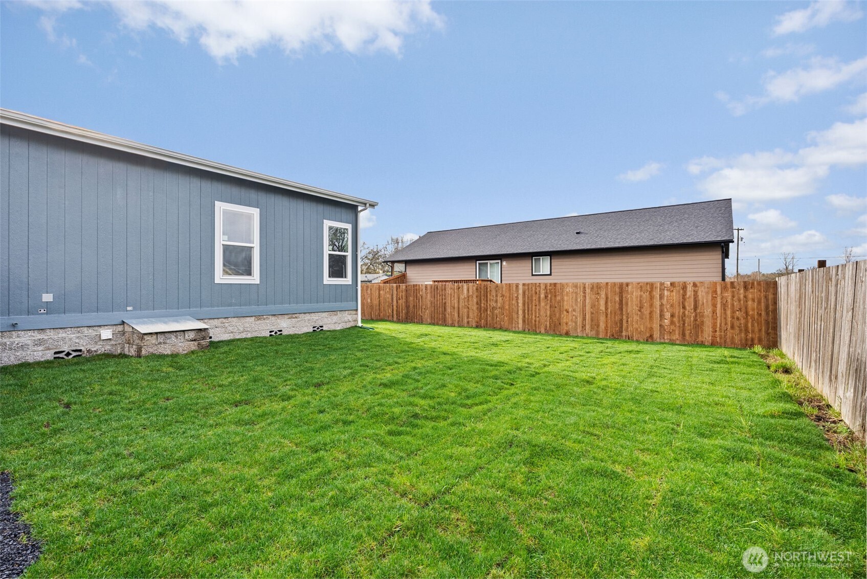 1257 Southwest Elzina Street Chehalis, WA 98532 - Photo 24 of 28 a view of a backyard with a garden