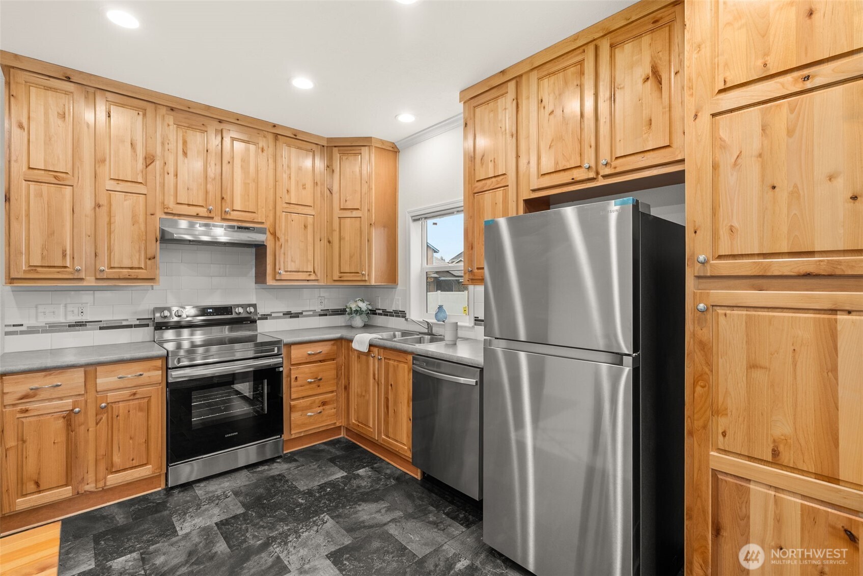 1257 Southwest Elzina Street Chehalis, WA 98532 - Photo 4 of 28 a kitchen with stainless steel appliances granite countertop a refrigerator sink and cabinets