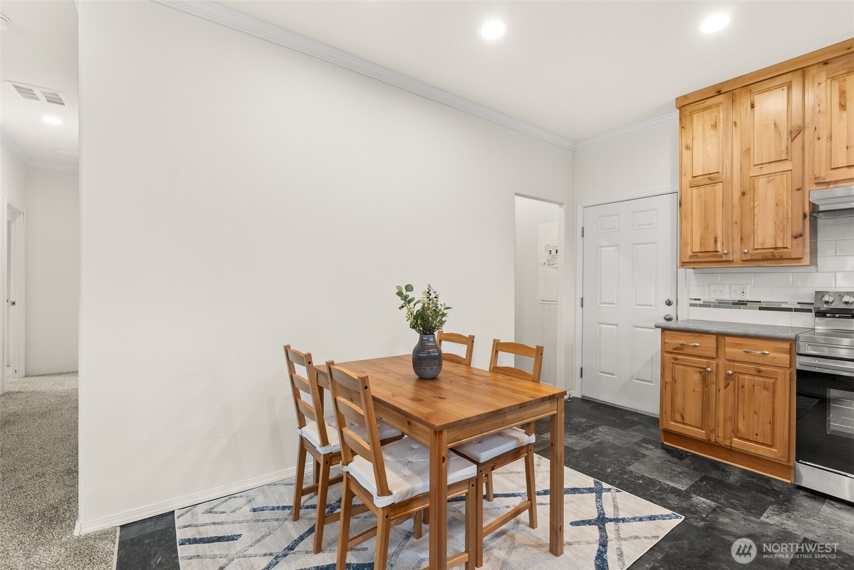 1257 Southwest Elzina Street Chehalis, WA 98532 - Photo 8 of 28 a kitchen with a table and chairs in it