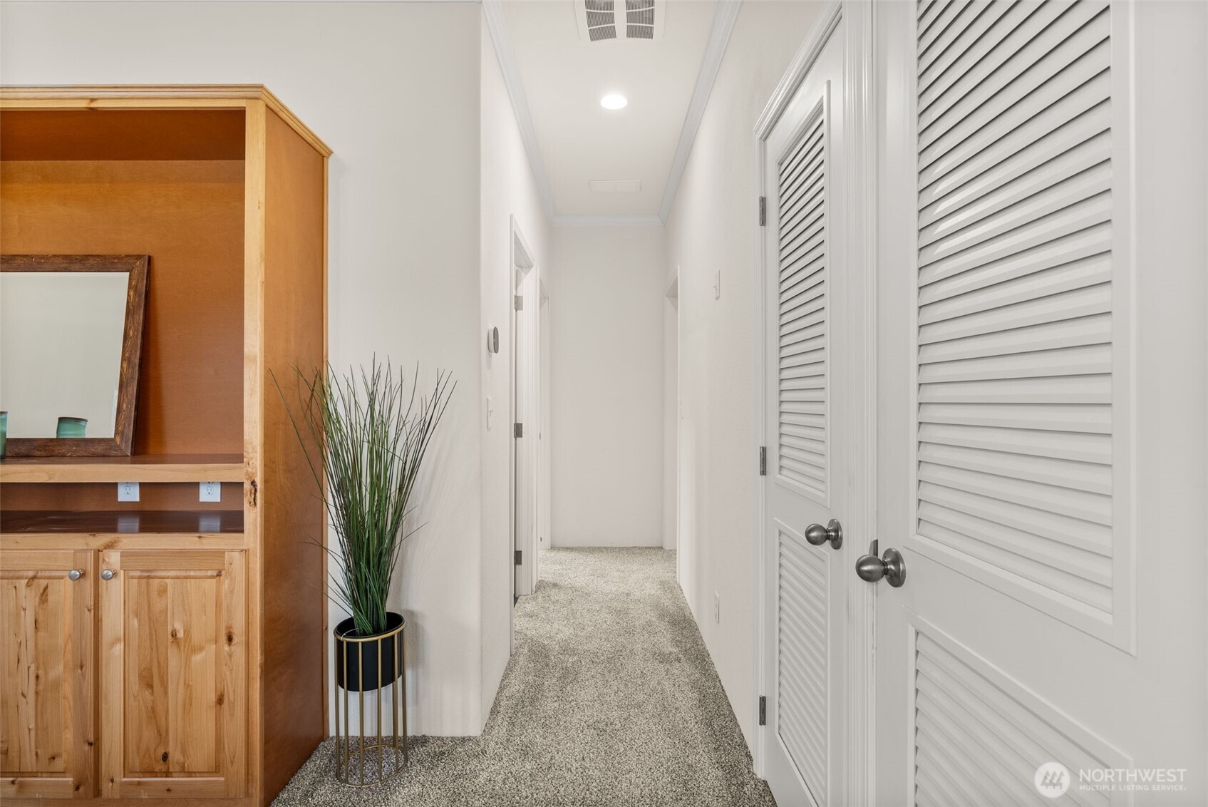 1257 Southwest Elzina Street Chehalis, WA 98532 - Photo 9 of 28 a view of a hallway with paintings on the wall