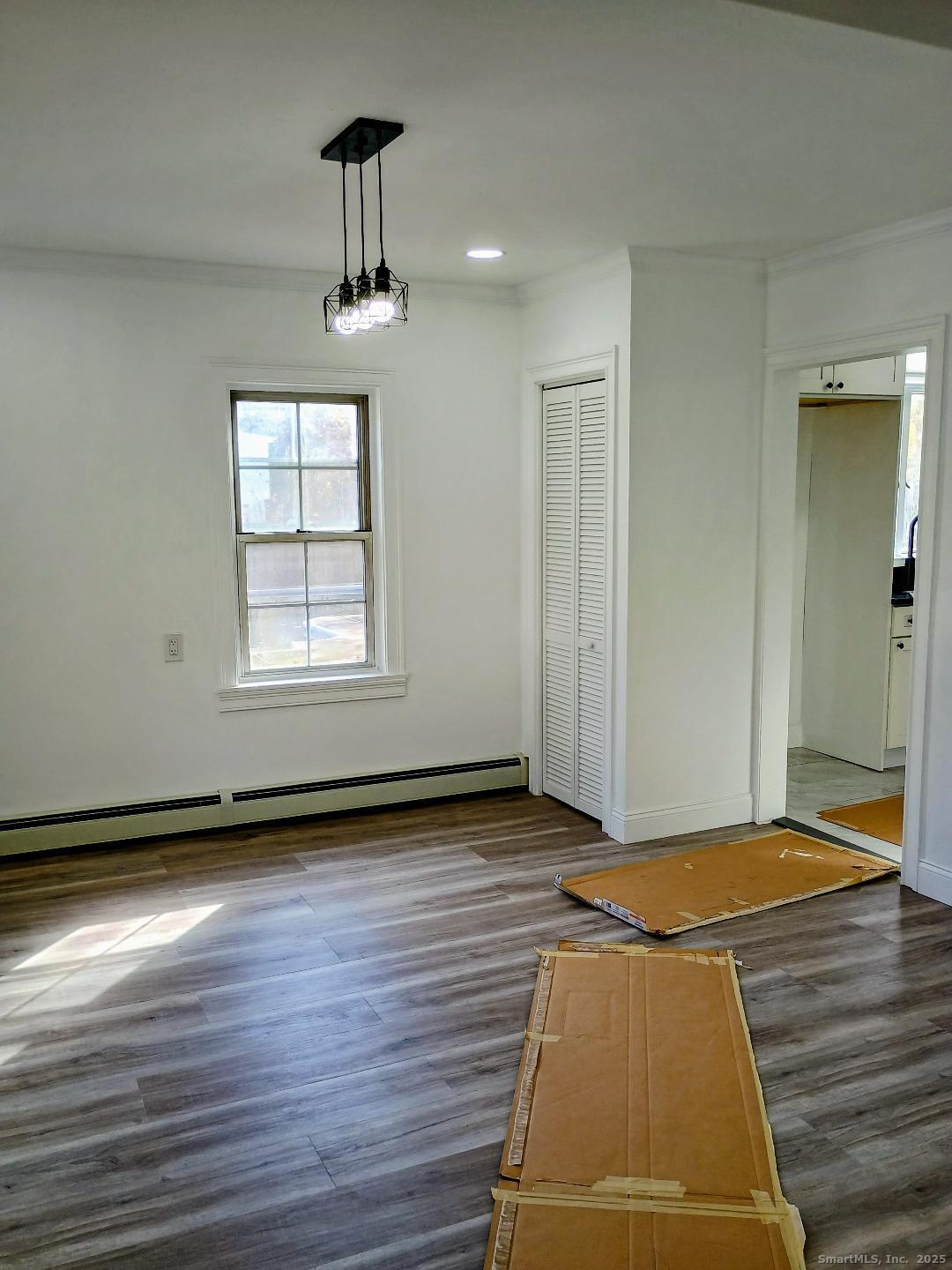 633 Wauregan Road Brooklyn, CT 06234 - Photo 4 of 15 wooden floor in an empty room with a window