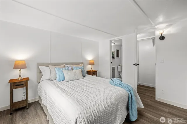 a bedroom with a bed and a lamp