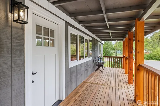 a view of porch with wooden floor
