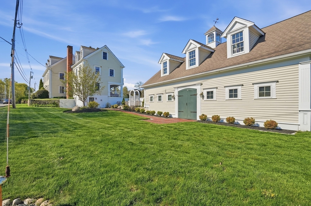183 Whiting Street Hanover, MA 02339 - Photo 38 of 42 a view of a house with a yard