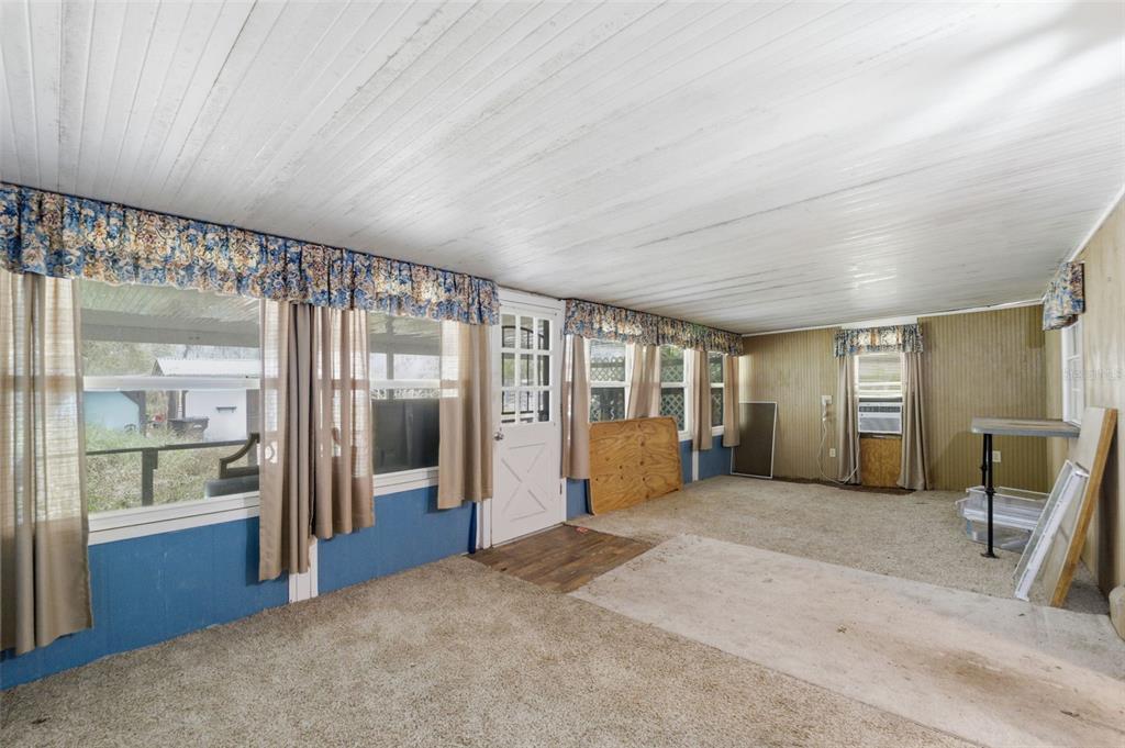 2220 Ellie Road, Unit A Auburndale, FL 33823 - Photo 20 of 41 a view of a room with large windows and furniture