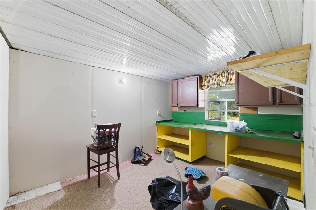 2220 Ellie Road, Unit A Auburndale, FL 33823 - Photo 22 of 41 a room with furniture and a table