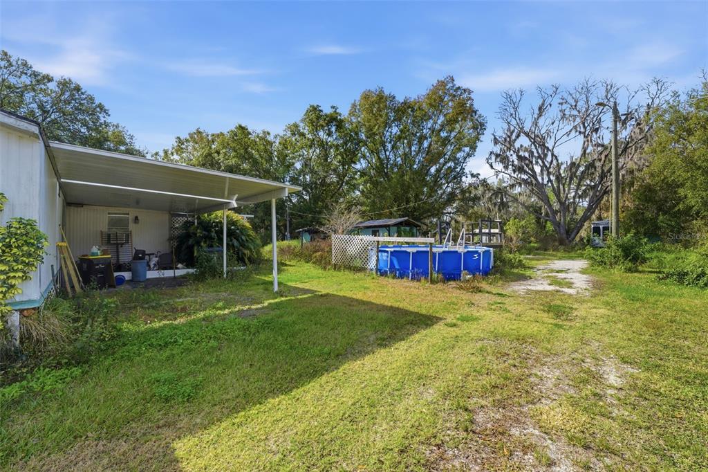 2220 Ellie Road, Unit A Auburndale, FL 33823 - Photo 25 of 41 a view of a house with backyard and sitting area