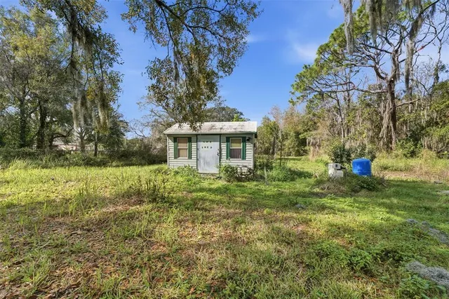 a view of a car park in front of a house