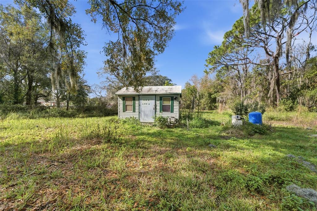 2220 Ellie Road, Unit A Auburndale, FL 33823 - Photo 31 of 41 a front view of a house with garden