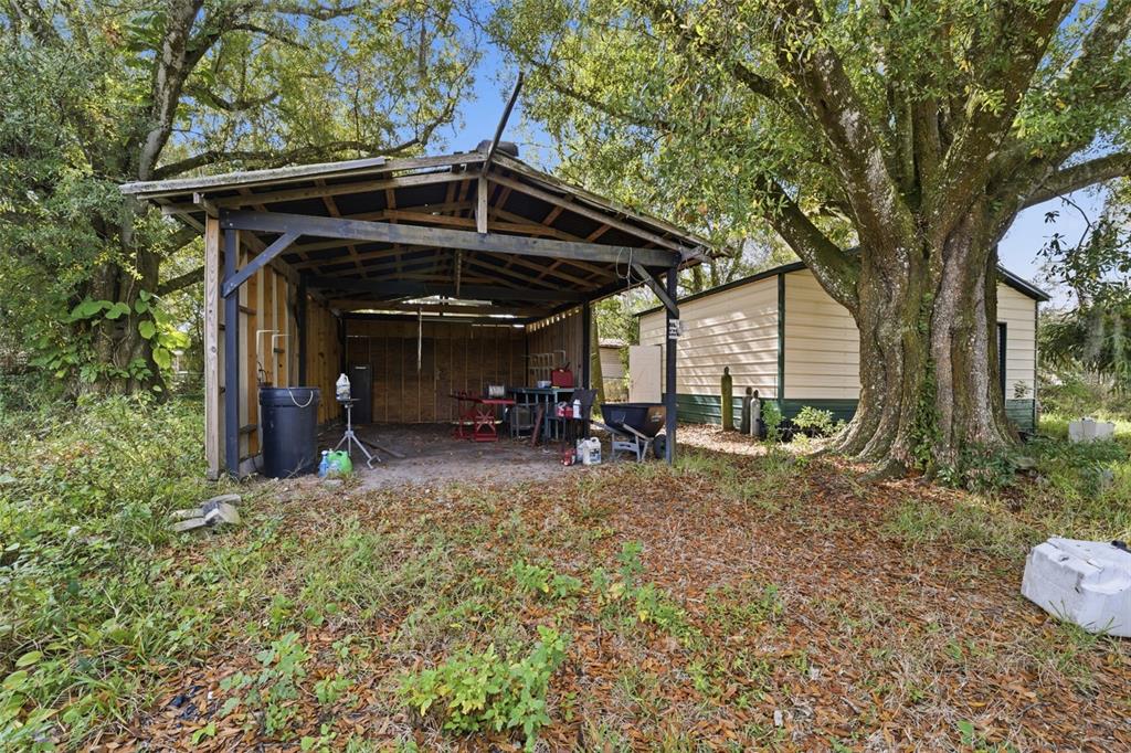 2220 Ellie Road, Unit A Auburndale, FL 33823 - Photo 32 of 41 a view of a car park in front of a house