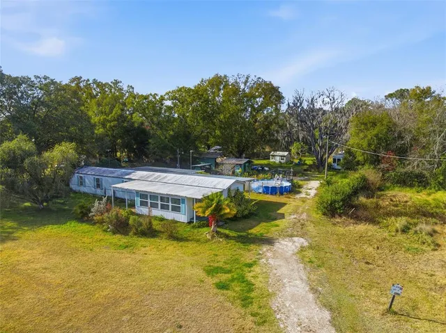 a view of a swimming pool with a patio