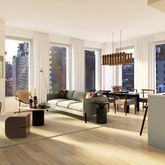 a living room with furniture and large windows