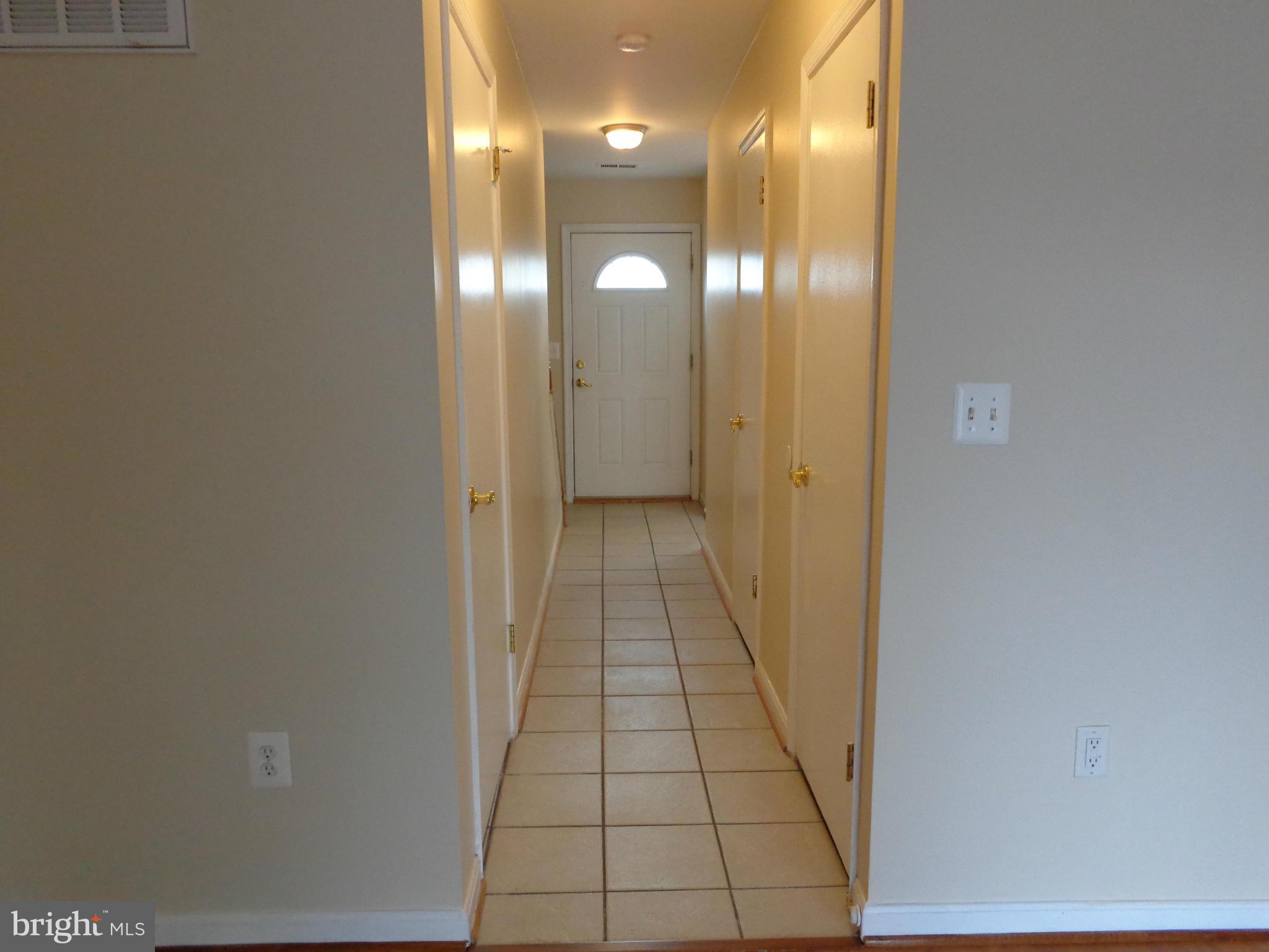7782 Gateshead Lane Manassas, VA 20109 - Photo 9 of 17 a view of a hallway with wooden floor