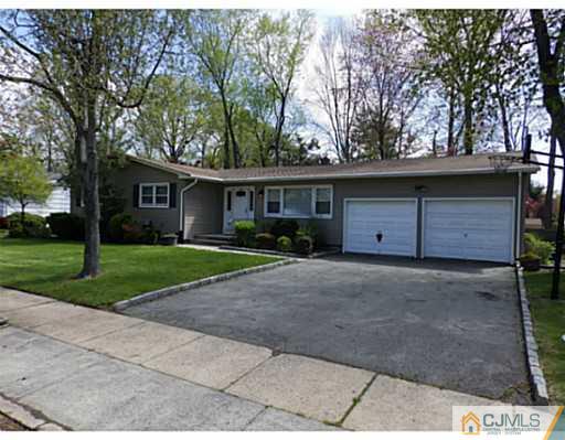 22 Lynnwood Road Edison, NJ 08820 - Photo 1 of 19 a view of a house with a yard and large tree