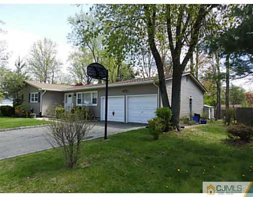 22 Lynnwood Road Edison, NJ 08820 - Photo 2 of 19 a view of a house with backyard and a tree