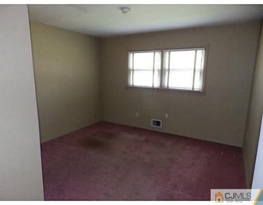 22 Lynnwood Road Edison, NJ 08820 - Photo 11 of 19 a view of an empty room with a window