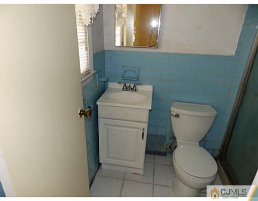 22 Lynnwood Road Edison, NJ 08820 - Photo 15 of 19 a bathroom with a toilet and a sink