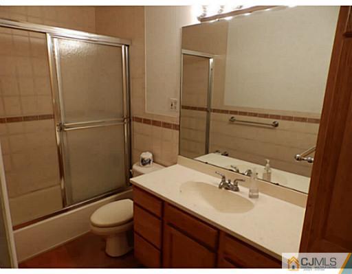 22 Lynnwood Road Edison, NJ 08820 - Photo 16 of 19 a bathroom with a sink toilet and shower