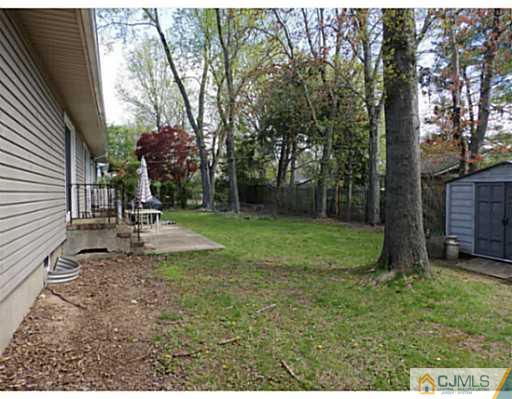 22 Lynnwood Road Edison, NJ 08820 - Photo 5 of 19 a view of a park with a tree