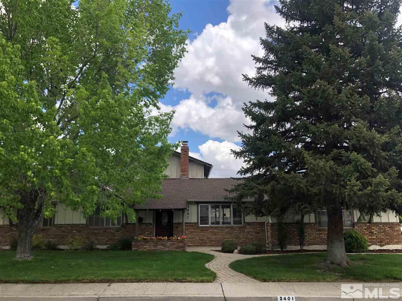 2401 Balsam Street Reno, NV 89509 - Photo 1 of 18 a front view of a house with a yard