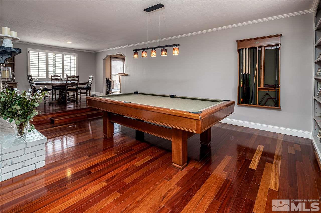 2401 Balsam Street Reno, NV 89509 - Photo 3 of 18 a room with wooden floor pool table and windows