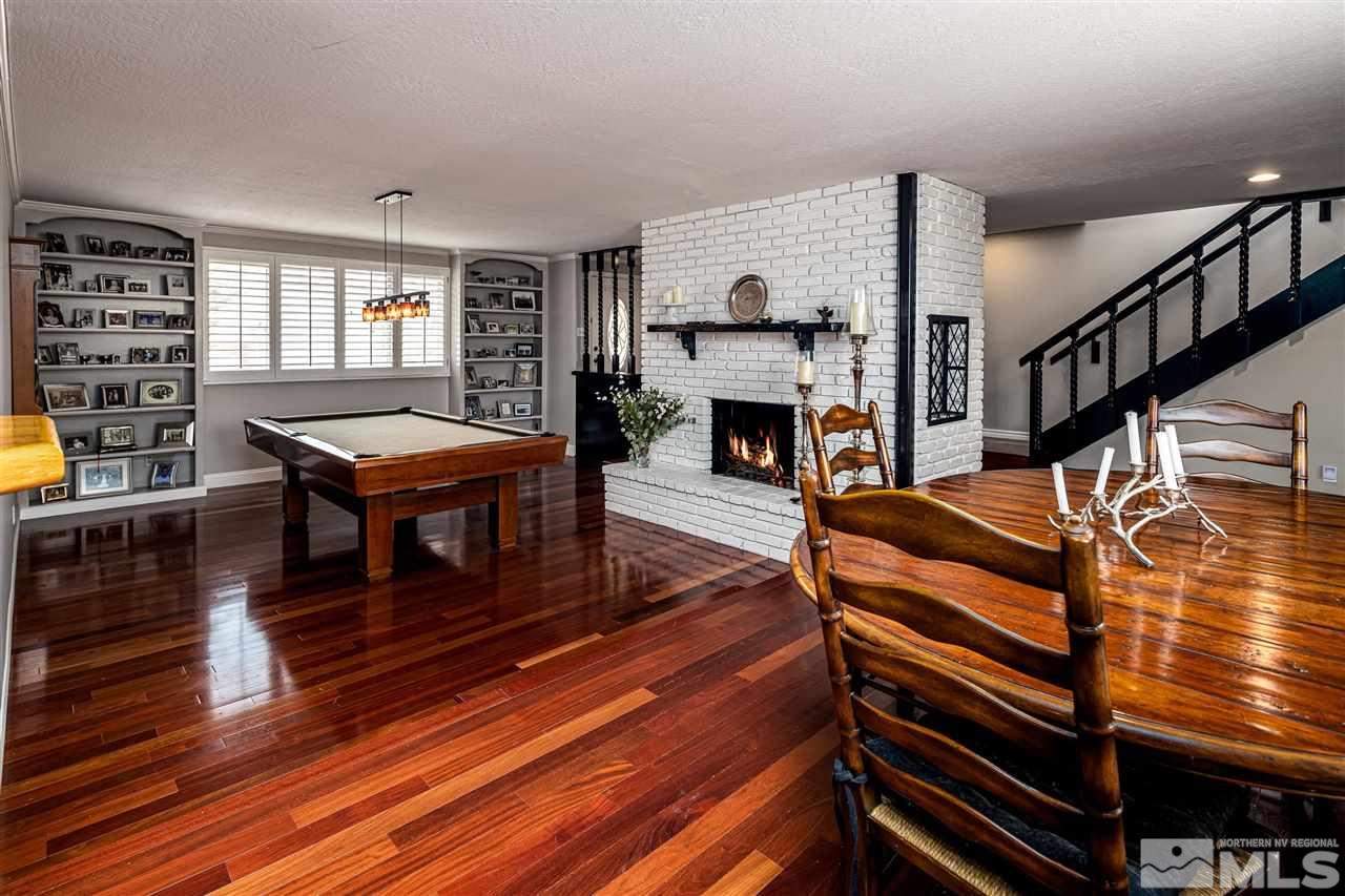 2401 Balsam Street Reno, NV 89509 - Photo 4 of 18 a living room with furniture a piano and a fireplace