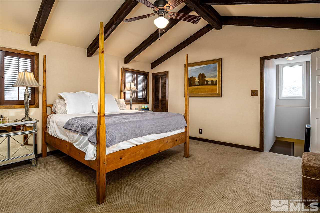 2401 Balsam Street Reno, NV 89509 - Photo 10 of 18 a bedroom with a bed and wooden floor