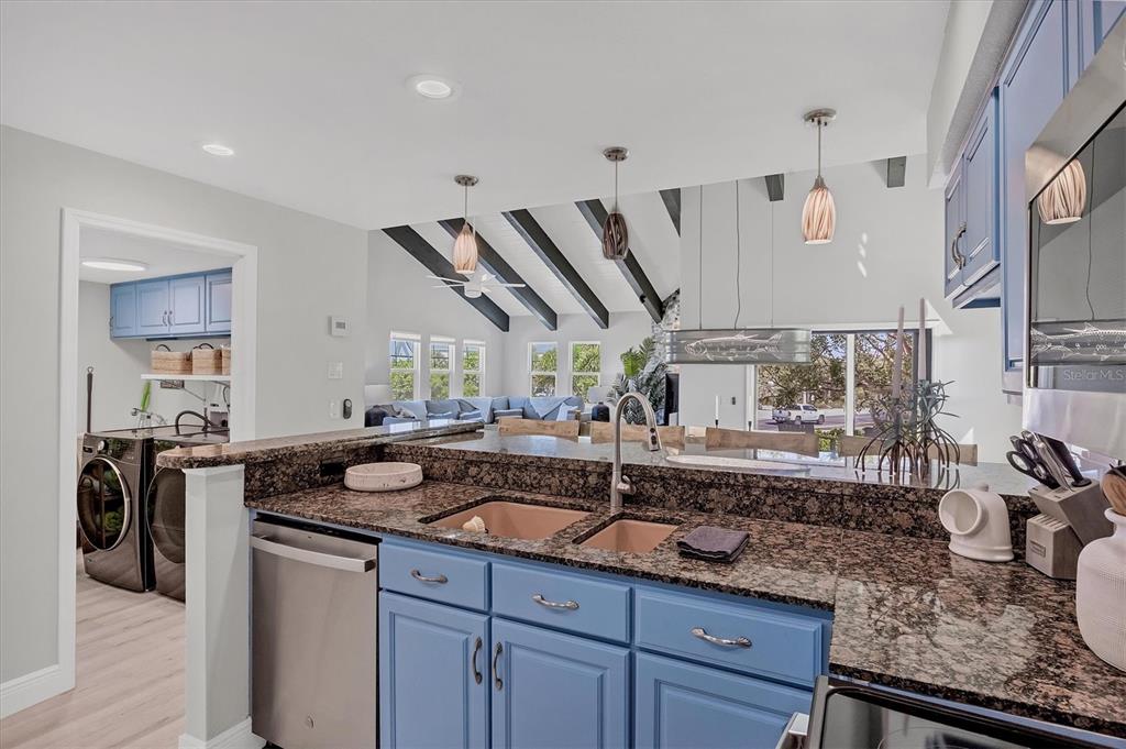 401 Lafitte Street Boca Grande, FL 33921 - Photo 13 of 37 a kitchen with a sink and stove