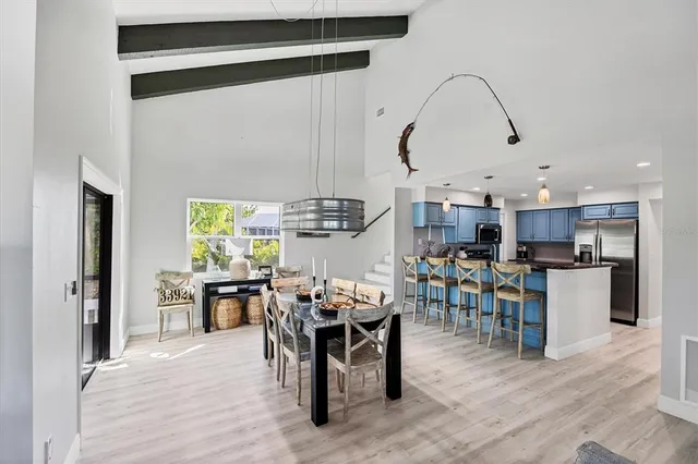 a view of a dining area with furniture window and wooden floor