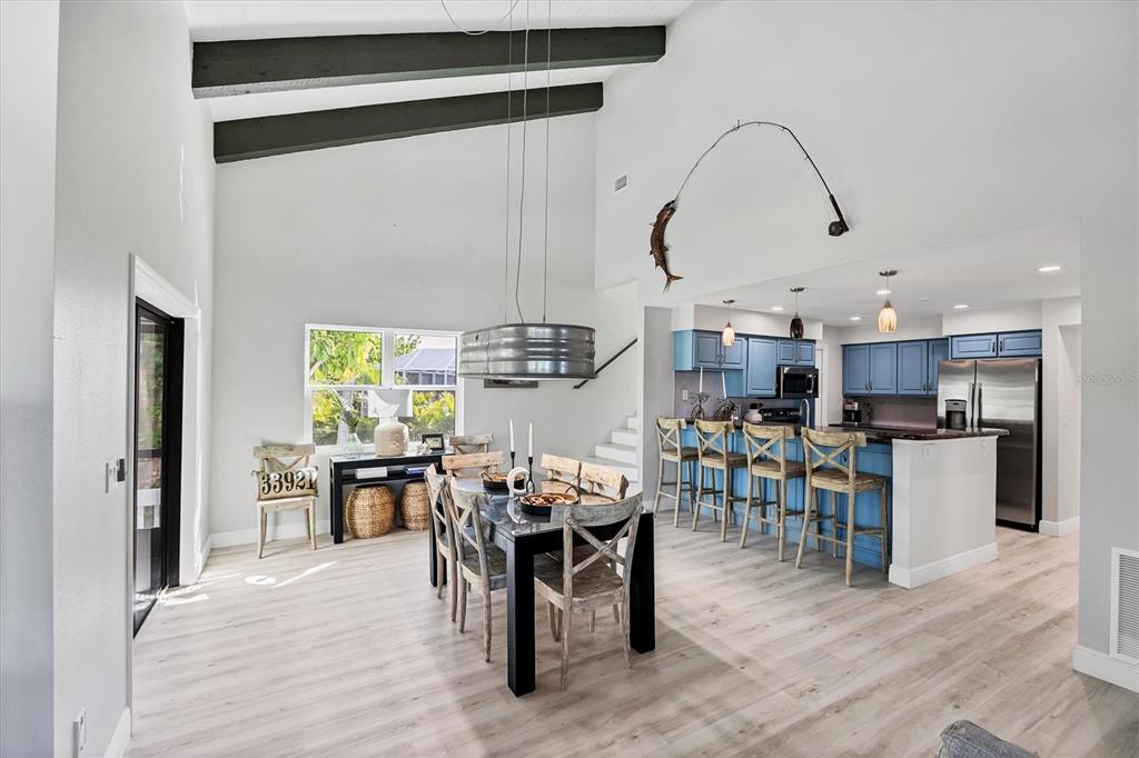 401 Lafitte Street Boca Grande, FL 33921 - Photo 14 of 37 a view of a dining area with furniture window and wooden floor