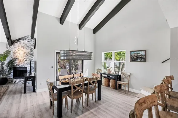 a view of a dining room with furniture window and wooden floor