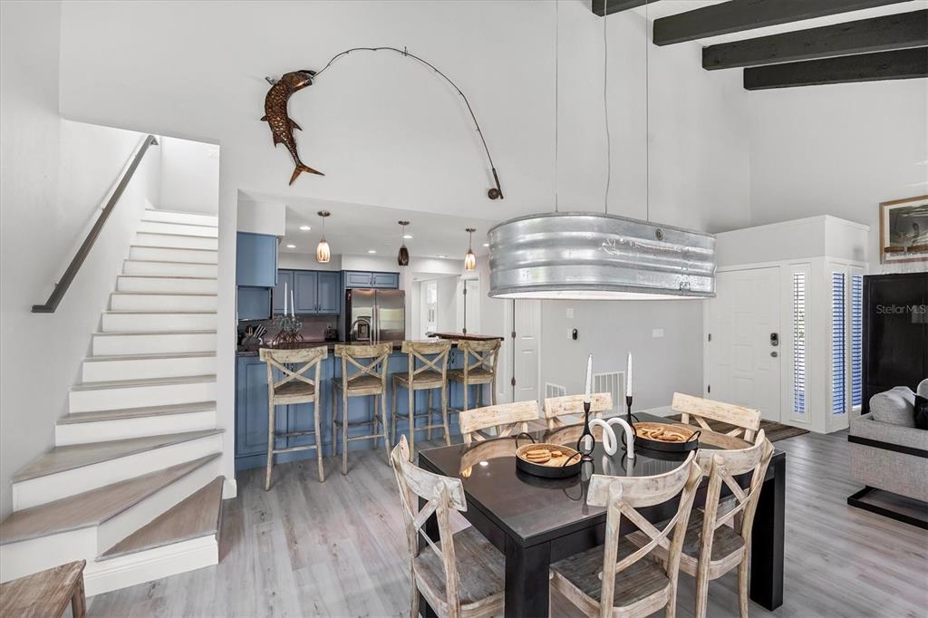 401 Lafitte Street Boca Grande, FL 33921 - Photo 16 of 37 a dinning area with furniture and wooden floor