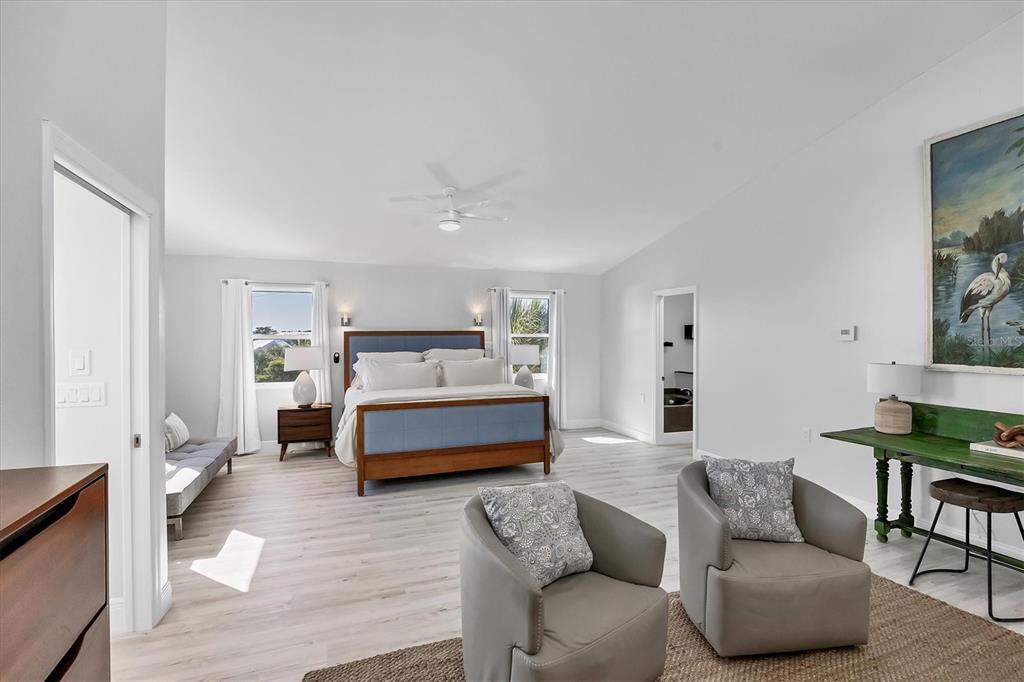 401 Lafitte Street Boca Grande, FL 33921 - Photo 17 of 37 a bedroom with furniture and a couch