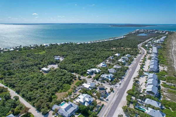 an aerial view of beach and ocean