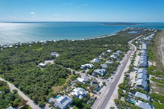an aerial view of beach and ocean