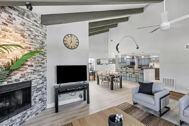 a living room with furniture a rug and a fireplace