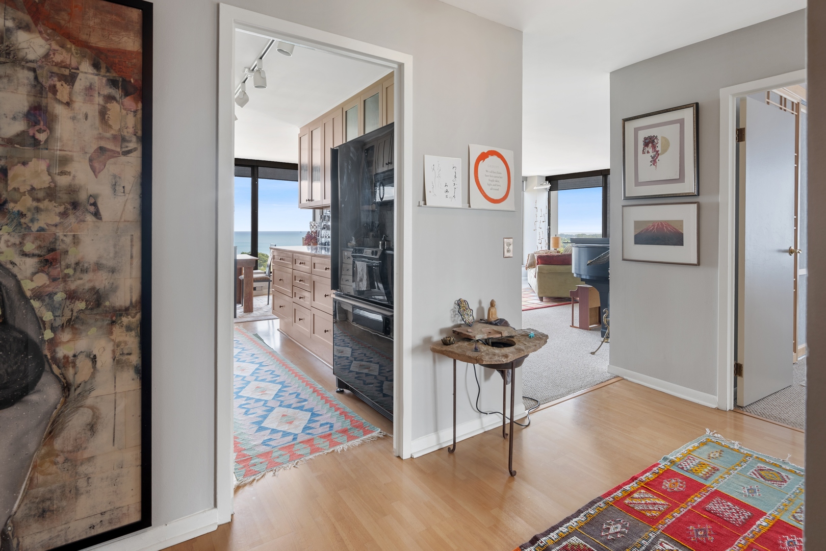 5445 North Sheridan Road, Unit 1212 Chicago, IL 60640 - Photo 2 of 14 a living room with furniture and a rug