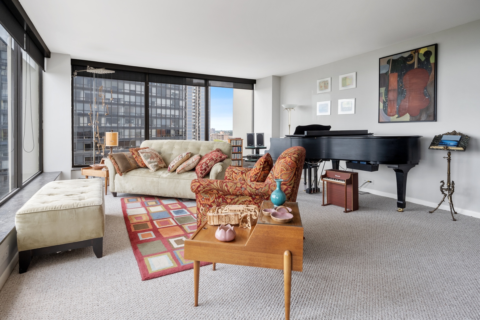 5445 North Sheridan Road, Unit 1212 Chicago, IL 60640 - Photo 3 of 14 a living room with furniture and a large window