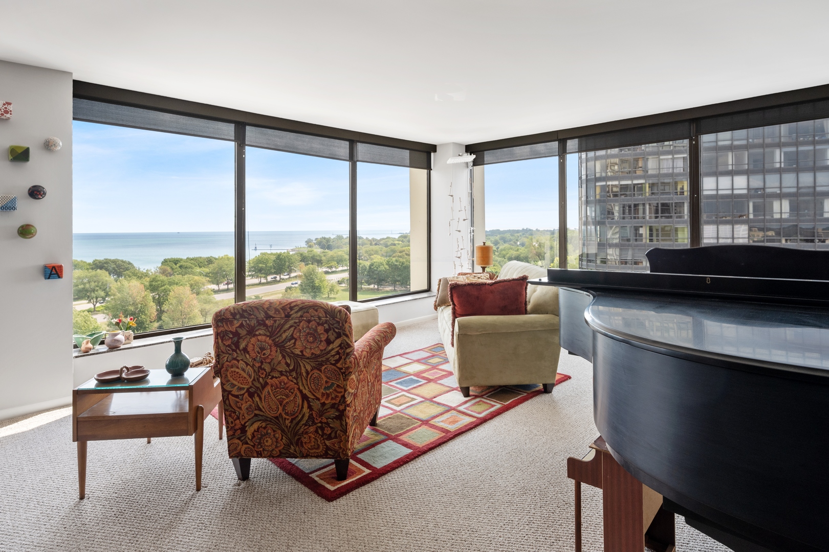 5445 North Sheridan Road, Unit 1212 Chicago, IL 60640 - Photo 4 of 14 a living room with furniture and a large window