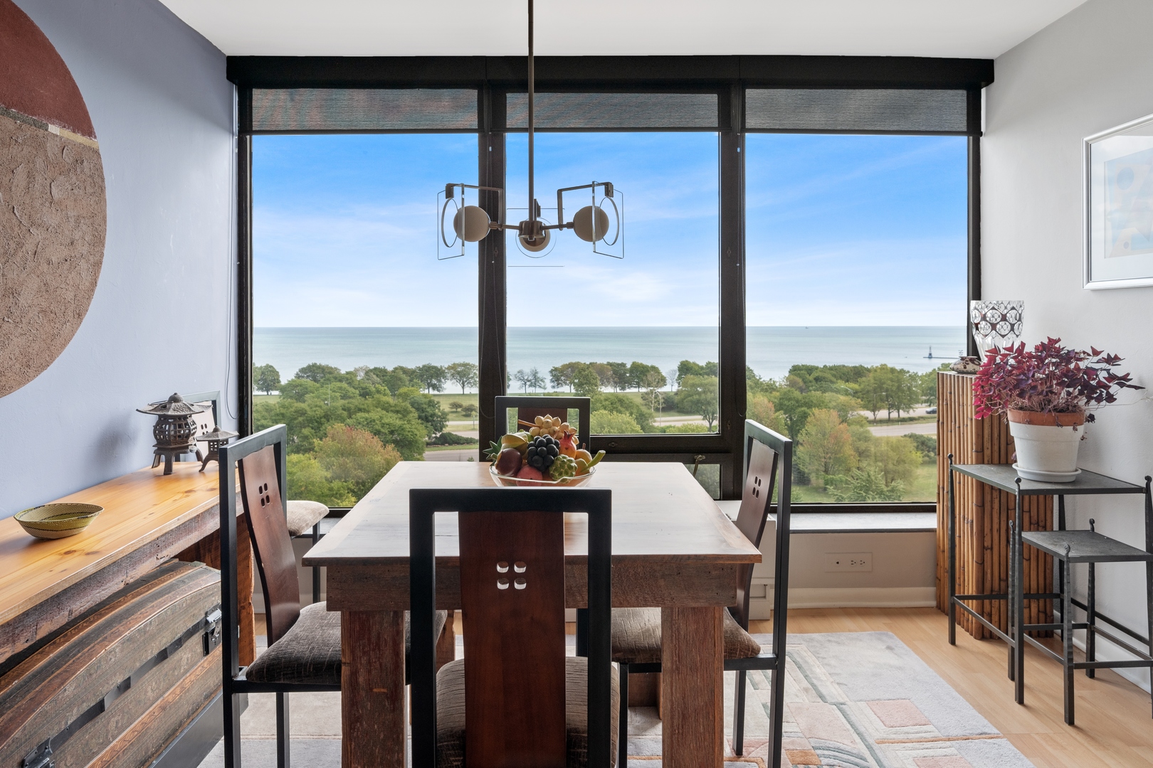 5445 North Sheridan Road, Unit 1212 Chicago, IL 60640 - Photo 6 of 14 a view of a dining room with furniture window and outside view