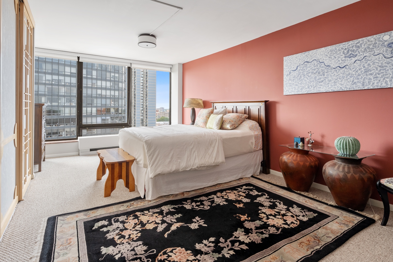 5445 North Sheridan Road, Unit 1212 Chicago, IL 60640 - Photo 8 of 14 a bed room with a bed and a couch