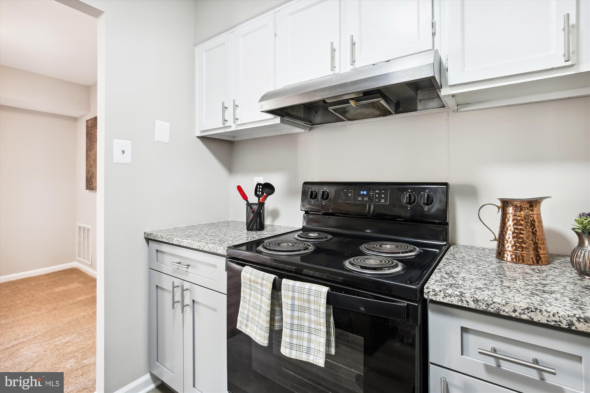 6143 Edsall Road, Unit H Alexandria, VA 22304 - Photo 9 of 18 a kitchen with stainless steel appliances granite countertop a stove and a cabinets