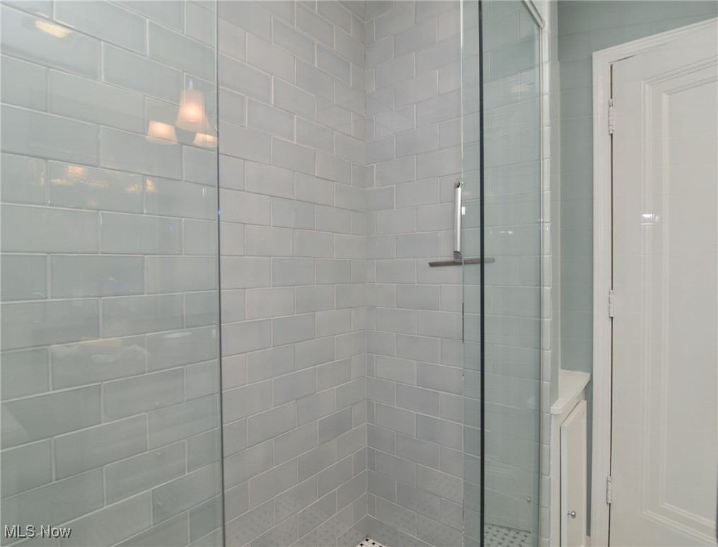 2887 Kingsley Road Shaker Heights, OH 44122 - Photo 19 of 40 A closeup view of the oversize subway tile in a soft green hue