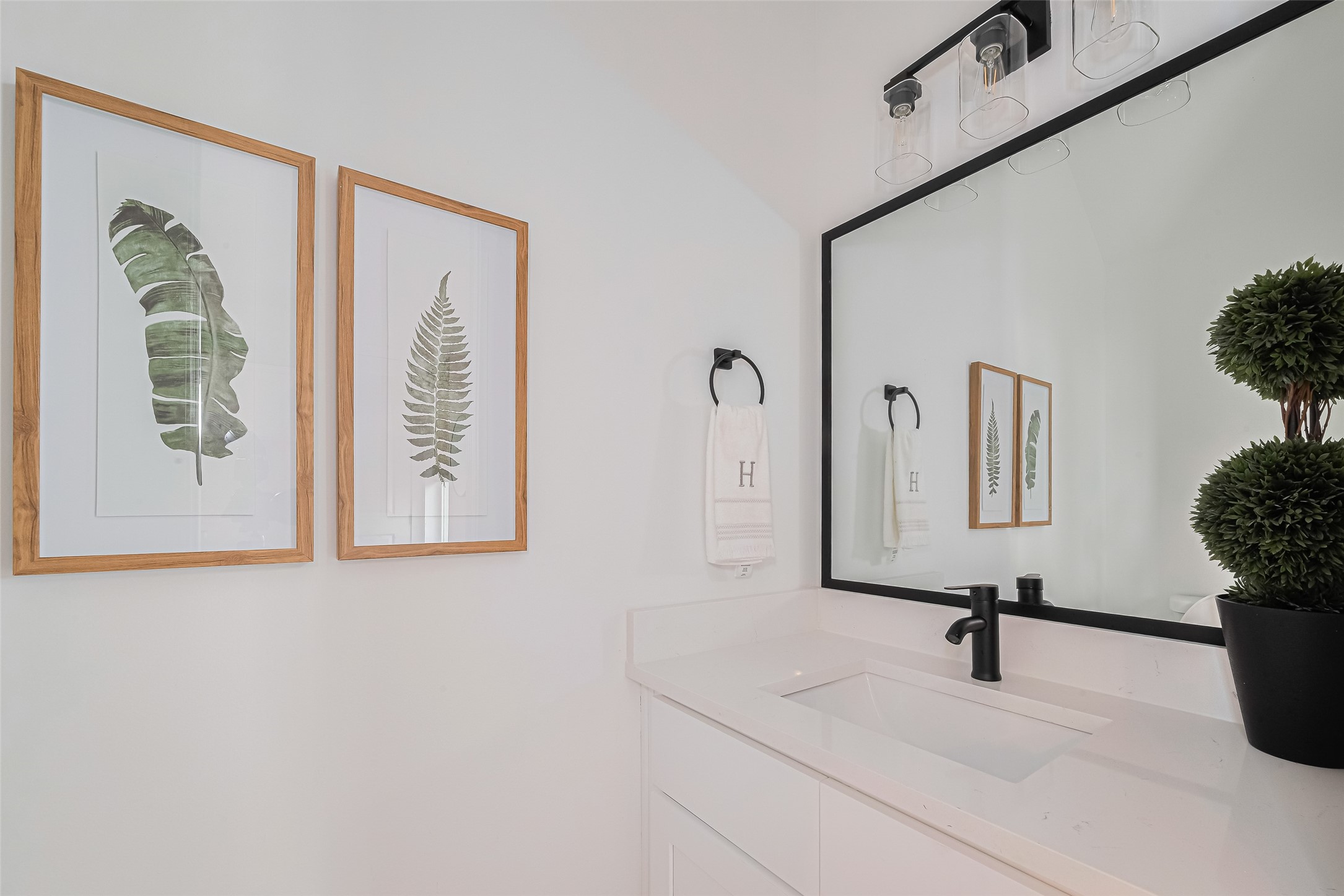 9437 Pembrook Street Houston, TX 77016 - Photo 11 of 25 a bathroom with a sink and a mirror