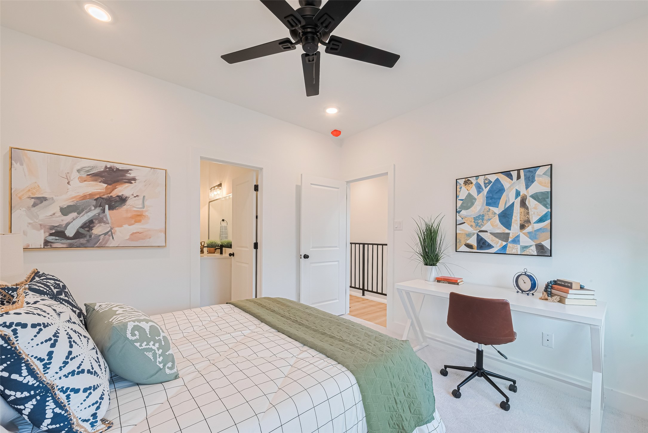 9437 Pembrook Street Houston, TX 77016 - Photo 13 of 25 a bedroom with a bed and a painting on the wall