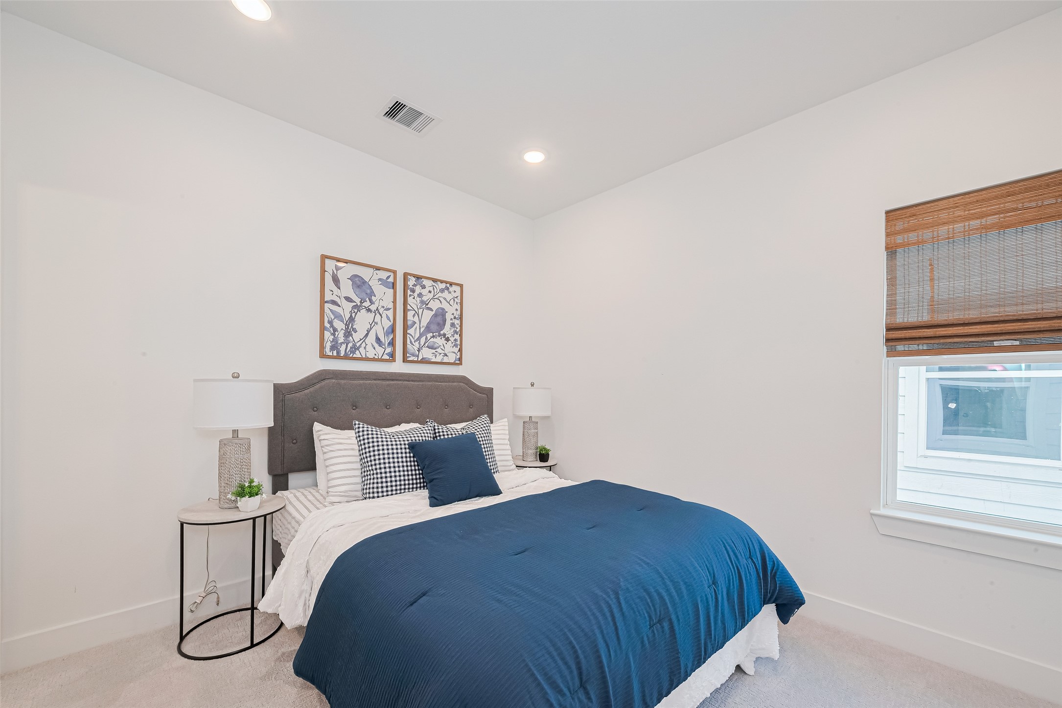 9437 Pembrook Street Houston, TX 77016 - Photo 18 of 25 a bedroom with a bed and night stand